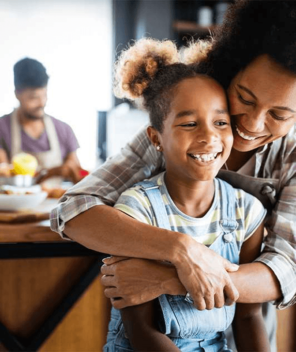 Family looking at laptop